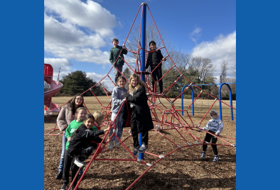  students on the rope climbing equipment at recess